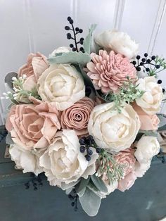 a bouquet of flowers sitting on top of a table