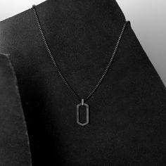 Modern geometric dog-tag with box chain metal cord. Featured in our industrial minimalist men's jewelry drop. Available in black, gold or silver. Masculine Black Stainless Steel Jewelry, Black Chain Jewelry For Everyday Use, Modern Black Necklaces For Everyday Use, Black Stainless Steel Jewelry For Everyday Use, Masculine Black Jewelry For Gift, Black Necklace With Adjustable Chain For Everyday Use, Modern Black Necklace For Everyday Use, Modern Black Necklace For Everyday, Father's Day Black Metal Jewelry