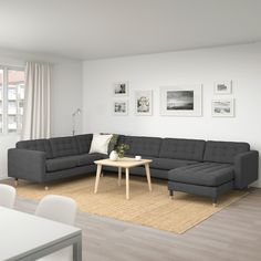 a living room filled with furniture and white walls