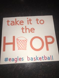 a sign that says take it to the hoop eagles basketball is in orange and white