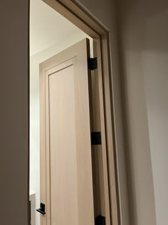 an open wooden door in a room