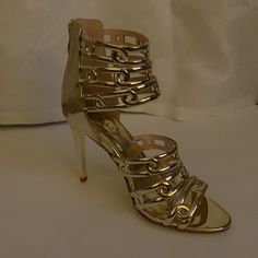 New With Box, Never Worn Gold Heels, Approximately 4 Inches High. Very Nice Shoes, The Only Issue Is The Spilled Glue Made From Factory Which Is Not Noticeable. Gold Heels With 4-inch Heel For Event, Gold Open Heel Heels For Events, Gold Wrapped Heel Cocktail Heels, Gold Heels With Wrapped Heel For Cocktail, Gold Cocktail Heels With Wrapped Heel, Chic Gold Heels For Events, Gold High Heels For Events, Gold Elegant Heels With Round Toe, Ivory Heels