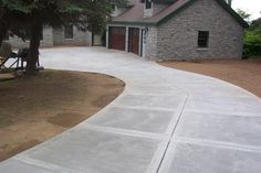 a house with a large driveway in front of it