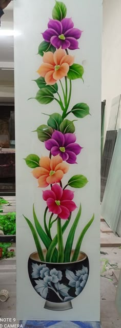 a sign with flowers painted on it