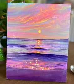 an acrylic painting of a sunset over the ocean with purple and pink colors