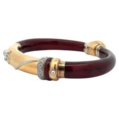 Material:18k Yellow Gold - Sterling Silver Accents - Deep Red Enamel Weight: 36.21 Grams Type: Twist Hinge Bangle Length: Will comfortably fit up to 7” wrist (fitted on wrist) Closure: Ball w/ Snap closure Overall Width: 73mm (2.87”) (approx.) Thickness: 10.4mm (0.40") rise off wrist Condition: Shows some light surface wear & light patina.. Excellent condition! Stock Number: JO-600101150-04092412 Diamond Bangle Bracelet, 21 Grams, Diamond Bangles Bracelet, Diamond Bangle, Hinged Bangle, Silver Accents, Deep Red, Gold And Silver, Bangle Bracelet