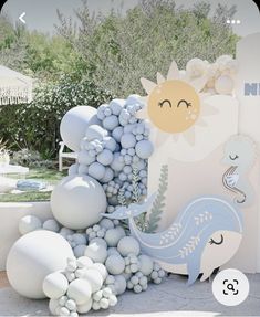 there is a sculpture made out of balloons and other items in the shape of animals