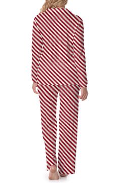 Made without tags for distraction-free comfort, you'll feel comfy whenever you slip into these pajamas made from festively striped, supersoft jersey with plenty of stretch. KicKee Pants' signature fabric even has built-in sun protection, so you can wear them out for an extra-long dog walk if you feel like it. Top has front button closure; notched collar; long sleeves; chest patch pocket Bottoms have elastic/drawstring waist UPF 50+ sun protection 95% viscose, 5% spandex Machine wash, tumble dry Long Dog, Dog Walk, Kickee Pants, Striped Pyjamas, Notched Collar, Dog Walking, Upf 50, Candy Cane, Extra Long