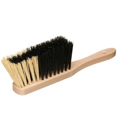 a wooden brush with black bristles on it