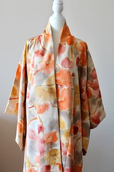 🌸Vintage Homongi Yellow Orange Long Kimono Jacket in medium weight silk crepe with a beautiful Japanese flower floral  pattern. Traditional lining. You can wear this kimono for formal events like wedding parties, annual parties, parents' days or simply for visiting friends. Both married and unmarried women can wear these kind of semi-formal kimono types. 🌸MEASUREMENTS taken lying flat : Width : Back of the neck to end of the sleeve 62cm (24.5inch) Length : 150cm (59inch) 🌸MATERIAL: Japanese Silk 🌸CARE : dry clean recommended 🌸CONDITION: vintage and good condition. Please note there are some aged stains on the lining inside near the neckline. All kimono are originally made in Japan.  🌸COLOR: All my pictures are taken with natural light, please refer to the photos and video for best id Spring Silk Outerwear With Kimono Sleeves, Silk Outerwear With Kimono Sleeves For Spring, Silk Long Sleeve Floral Print Kimono, Kimono Types, Formal Kimono, Long Kimono Jacket, Unmarried Women, Fashion Japanese, Japanese Clothing