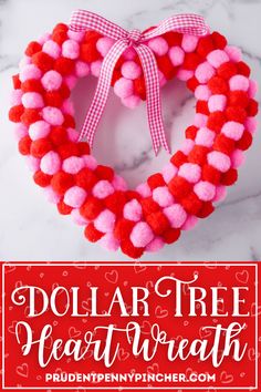 a heart shaped wreath with pom - poms on it and the words dollar tree heart