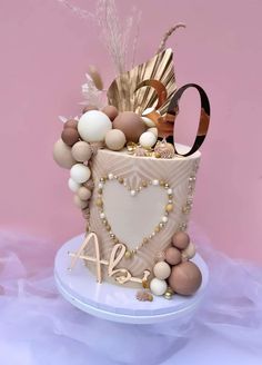 a cake decorated with lots of different types of decorations on top of a white plate