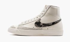 The Women’s Nike Blazer Mid ‘77 “Sail/Snakeskin” is the women’s version of the retro basketball shoe in a casual colorway with luxurious Swoosh branding.  The classic Nike Blazer is one of the brand’s first performance basketball shoes, a style that debuted back in the 1970s alongside other shoes like the Nike Bruin.  Here, the “Sail/Snakeskin” is complete with a Sail-colored leather upper that looks great whether box-fresh or worn.  A snakeskin Swoosh on the sides gives the shoe a premium, life Snakeskin Shoes, Snake Skin Shoes, Retro Basketball Shoes, Nike High Tops, Retro Basketball, Womens Blazer, Nike Blazer Mid 77, Nike Blazer Mid, Nike Blazers Mid