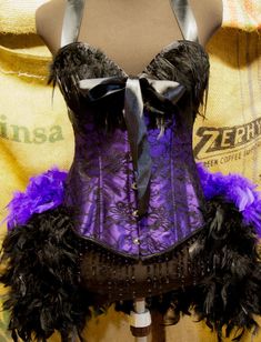 "GORGEOUS HALLOWEEN COSTUME! (See sizing description below) INCLUDED IN LISTING: FEATHER CORSET COSTUME MINI TOP HAT or FEATHER FASCINATOR (default) *For an extra $40, I can put black feathers in the front of the dress. Corset Sizes Available In: Small Approximately: 32-34\" Bust, 24-26\" waist (Bra size 32B-34B) Medium Approximately: 34-36\" Bust, 26-27\" waist (34B-36A/B) Large Approximately: 36-38\" Bust, 28-30\" waist XL Approximately: 38-40\" Bust, 30-32\" waist *Not sure what size you need Can Can Dress, Feather Corset, Saloon Dress, Circus Dress, Burlesque Corset, Purple Martin, Carnival Dress, Sewing Barbie Clothes, Corset Costumes