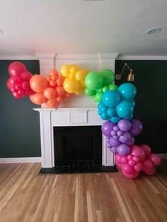 there is a bunch of balloons in front of the fireplace