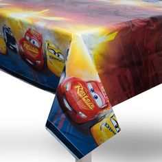 the table cloth is designed to look like characters from cars and lightning fast food trucks