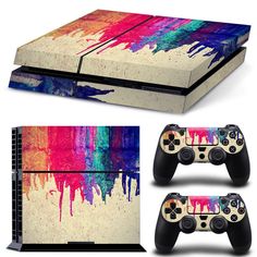 an image of a video game console and controller cover with colorful paint splattered on it