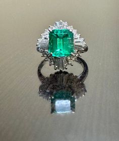 DeKara Designs Classic Metal- 85% Platinum, 15% Iridium. Size- 5 1/4. FREE SIZING Stones- Emerald Cut Colombian Emerald 2.58 Carats, 24 Round Diamonds F-G Color VS2 Clarity, 12 Tapered Baguette Diamonds F-G Color VS2 Clarity 0.95 Carats Total Diamond Weight. Gorgeous Art Deco Platinum Diamond Emerald Cut Colombian Emerald Engagement Ring That is Entirely Handmade. This ring features a beautiful green and and high clarity Colombian Emerald. The Emerald is professionally and securely set in betwee Platinum Diamond Wedding Ring, Engagement Ring Square, Colombian Emerald Ring, Square Engagement Rings, Ring Square, Baguette Diamonds, Etsy Wedding Rings, Colombian Emeralds, Emerald Engagement