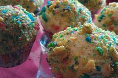 there are some cupcakes that have sprinkles on them