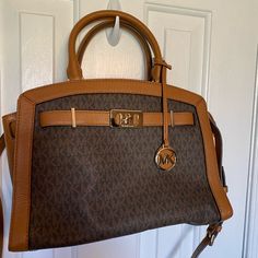 Tan Micheal Kors Karaon Satchel Classic Brown Michael Kors Satchel, Michael Kors Brown Travel Satchel, Michael Kors Brown Satchel For Travel, Michael Kors Luxury Brown Satchel, Michael Kors Classic Brown Bag, Luxury Brown Michael Kors Satchel, Michael Kors Brown Satchel For Daily Use, Chic Michael Kors Brown Satchel, Michael Kors Brown Double Handle Satchel