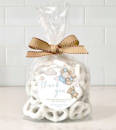 a bag filled with white cookies on top of a counter