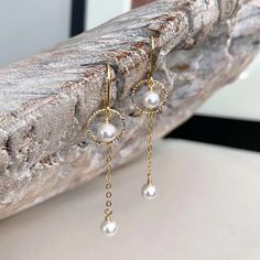 "Delicate long white Swarovski crystal pearl drop dangle earrings are finished delicate chain and either gold filled or sterling silver lever backs.  The small hammered hoops are vermeil gold or sterling silver.  Beautiful dainty earrings for a June birthday girl, bridesmaids or a special girl on any occasion.   The earrings measure approx 2.25\" from end to end and the Swarovski pearls are approx 6mm.  You may also like to check out more of my pearl jewelry and June birthstone gift ideas here: Long Pearl Earrings, Artisan Jewelry Handmade, Silver Pearl Earrings, June Birthday, Gold Pearl Earrings, Special Girl, Handmade Jewelry Gift, Delicate Chain, June Birthstone