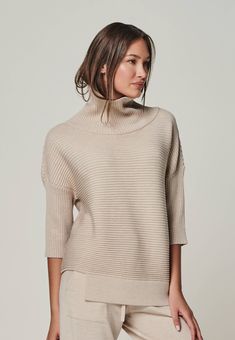 Women's capsule wardrobe essentials turtleneck front Modern Merino Wool Winter Tops, Beige Merino Wool Top For Fall, Fall Beige Merino Wool Tops, Elegant Merino Wool Fine Knit Tops, Elegant Ribbed Merino Wool Tops, Elegant Fine Knit Merino Wool Tops, Elegant Turtleneck Knit Top For Layering, Elegant Knit Top For Winter, Elegant High Neck Soft Knit Sweater