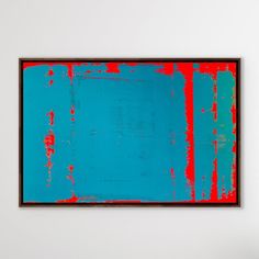 a blue and red painting hanging on the wall