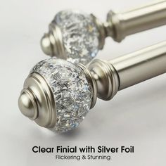 two metal handles with crystal knobs on each one and the words clear final with silver foil