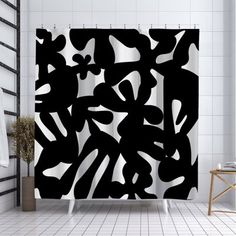 a black and white shower curtain in a bathroom