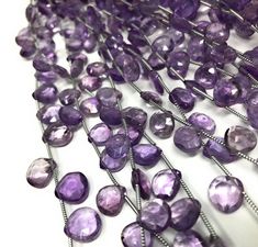 three strands of purple glass beads