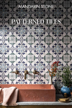 the front cover of mandarin stone's patterned tiles, featuring an orange sink and blue vases