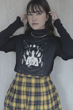 get ready to be 𝖔𝖇𝖘𝖊𝖘𝖘𝖊𝖉 with this Hekate shirt ☠︎︎ it's the perfect cozy alt tee to worship our goddess of witchcraft in or just to make any outfit ~ ✮ 𝖆𝖊𝖘𝖙𝖍𝖊𝖙𝖎𝖈 ✮ ~ 🕯🔮 🖤 𝖕𝖗𝖔𝖉𝖚𝖈𝖙 𝖎𝖓𝖋𝖔  ♡ Gildan 5000 Tshirt (Bella Canvas & Comfort Colors brand shirts available upon request + additional cost) ♡ 100% cotton, medium-weight fabric ♡ Comfy, relaxed unisex fit 🕯🔮 🖤 𝖘𝖎𝖟𝖎𝖓𝖌  ♡ Runs true to size, classic unisex fit ♡ Size up 2 sizes for an oversized look ♡ Swipe ➸ through product photos for Size Guide & measurements 🕯🔮 🖤 𝖘𝖍𝖎𝖕𝖕𝖎𝖓𝖌 𝖎𝖓𝖋𝖔  ♡ Processing time = 1-7 days ♡ Shipping time = 3-5 days ♡ Our items are individually made with love for each of our buyers. Because of this, our processing time is 1-7 business days (depending on order volume) pl Fairy Grunge Long Sleeve Halloween Tops, Halloween Long Sleeve Fairy Grunge Tops, Halloween Fairy Grunge Long Sleeve Tops, Fairy Grunge Long Sleeve T-shirt For Fall, Fairy Grunge Long Sleeve Graphic Top, Fairy Grunge Long Sleeve Top For Fall, Black Crew Neck Fairy Grunge Top, Black Fairy Grunge Crew Neck Top, Black Fairy Grunge Tops For Fall