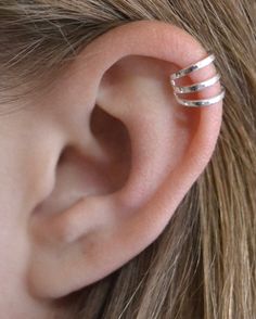 This is a fun Three Band Cartilage Ear Cuff. It really hugs the upper ear in a cage styling. It is a great pairing to wear with your other pierced earrings, or looks great as a stand alone piece. It hugs the high ear cartilage securely and comfortably. It will fit either ear and is available in Sterling Silver, 14K Gold Vermeil or Rose Gold Vermeil.  This piece will arrive in a Gift Box and include simple fitting instructions. Perfect for gift giving Ear Wraps, Cartilage Ear Cuff, Helix Ear, Wrap Earrings, Ear Pins, Silver Ear Cuff, Ear Cuffs, Engraved Items, Cuff Earrings