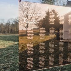 a large glass plaque with names on it