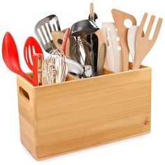 a wooden container filled with kitchen utensils