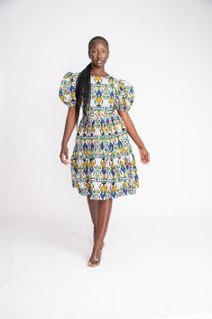 This dress is perfect for all outings. Wear to dates, work, movies, parties and much more. It's so versatile that it will easily suit any occasion. Handmade with 100% African wax cotton As always all our designs are fully handmade and custom made for you, so you are welcome to request any customisation, including length customisations to petite or tall, adding or removing anything of your choice from the design and even choosing a different fabric.  You are also welcome to send us your measurements if you have them or if you have someone to measure you accurately. Otherwise, just choose your size from our size chart, our sizes are accurate. Please leave a note of your height while ordering so we can use the best length for you.  Also, please feel free to message us for anything else. Thank White Printed Midi Dress, White Dress With All Over Print, Fitted Multicolor Print Midi Dress, Women Ankara Gown, African Midi Dress, Multicolor Print Knee-length Dress, African Dresses For Women Ankara, Dress African Print, Dress Ankara