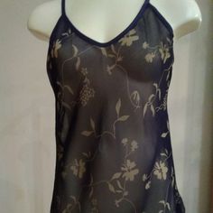 Sheer Navy Blue Chemise With Gold Floral Print. Adjustable Straps. 100% Polyester. Hand Wash Separately. Use Mild Soap. Drip Dry. Cool Iron. No Bleach. Made In U.S.A. Nwot Sheer Camisole Beach Tops, Sheer Camisole Tops For Beach, Sheer V-neck Top For Loungewear, Blue Camisole Top For Night, Fitted Sheer Camisole For Beach, Sheer Summer Night Top, Sheer Cami Top For Loungewear, Sheer Camisole Tops For Loungewear, Drip Dry