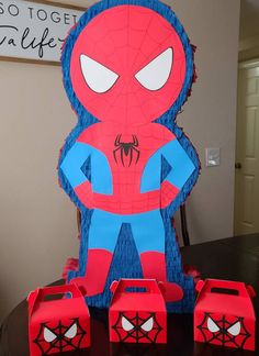 a spiderman themed birthday cake on a table