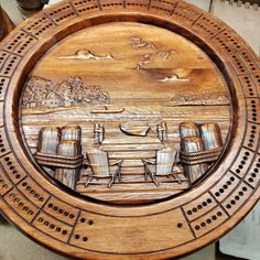 a wooden plate with an image of boats on the water