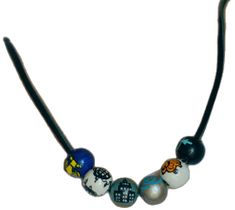 a necklace with different colored beads on it