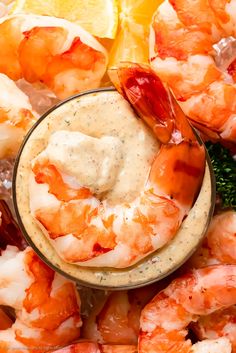 a bowl filled with shrimp and dipping sauce