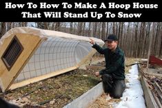 a man kneeling on the ground next to a snow covered field with an overhang