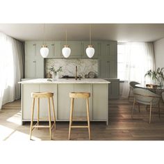 two stools are in front of the kitchen island