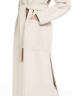 Find MAX MARA Cashmere And Wool Wrap Coat on Editorialist. Long wrap coat in hand-sewn, luxurious wool and cashmere zibeline double cloth. The style has a lapel collar, large patch pockets on the front and kimono sleeves with small slits on the cuff. Featuring large side slits on the hem. The matching belt fastening accentuates the feminine silhouette. Luxury Beige Wool Coat With Concealed Placket, Elegant Beige Wool Coat With Pockets, Luxury Long Beige Wool Coat, Beige Cashmere Wool Coat For Work, Luxury Beige Wool Coat With Pockets, Beige Long Cashmere Wool Coat, Elegant Spring Cashmere Wool Coat, Elegant Sweater Coat With Shawl Collar For Work, Long Cashmere Sweater Coat For Work