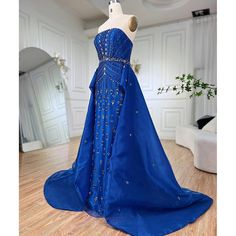 a blue gown on display in a room