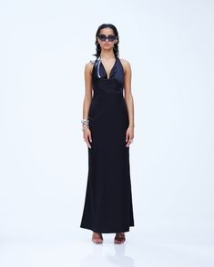 Slip into seduction with this black maxi dress 🖤 Made from luxurious satin charmeuse fabric, this piece is complete with a bias cut and a cowl neck for a look that gives off a chic and mysterious vibe that will have everyone hooked 😌 Charmeuse Fabric, Holly Black, Cargo Pant, Black Maxi, Black Maxi Dress, Black Satin, Dresses Xs, Cowl Neck, Shoe Collection