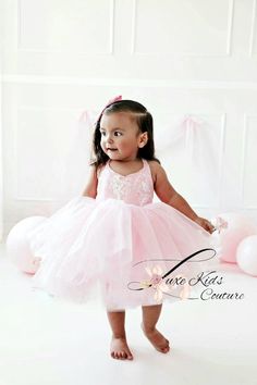 Pink Ballerina Couture dress Features a Light pink irredescent sequin top, straps that criss cross on the back corset style and a voluminous light pink tulle skirt. Our dresses are adjustable, they fit a size up as well as a size down. Customs welcomed. Can be made in other colors. Handmade to order in the USA Pink Irredescent, Baby Girl First Birthday Dress, Gold Tutu Dress, Pink Birthday Dress, First Birthday Dress, Gold Tutu, Pink Tutu Dress, Pink Tulle Skirt, First Birthday Dresses