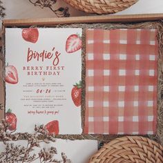 an open box with strawberries on it and the words bridal's berry first birthday