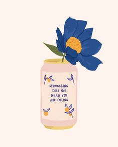 a blue flower sitting in a pink jar with writing on the side and an image of a blue flower sticking out of it